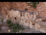 00926 ostia - regio ii - insula iv - terme di nettuno (ii,iv,2) - raum 9 - caldarium - suedostecke - tubuli - 06-2022.jpg